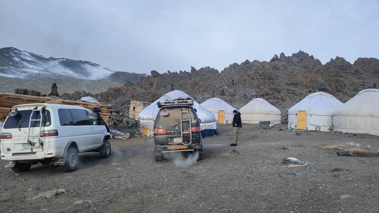 4x4 vehicles by ger camp in Altai